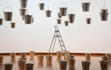 Rivane Neuenschwander, Rain Rains, 2002. Aluminum buckets, water, steel cable, ladder, dimensions variable. Installation view, Hiroshima City Museum of Contemporary Art, Hiroshima.