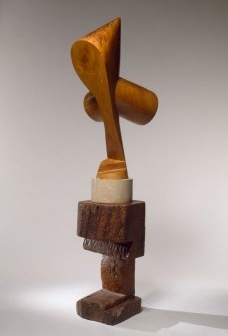 Constantin Brancusi, The Sorceress (La sorcière), 1916–24, and Watchdog (Chien de garde), 1916
The Sorceress: walnut, on a limestone base; Watchdog: oak, 177.2 x 49.5 x 64.8 cm overall<br />2010 Artists Rights Society (ARS), New York/ADAGP, Paris  [Solomon R. Guggenheim Museum]