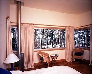 The bedroom with the view of the trees is on the upper level